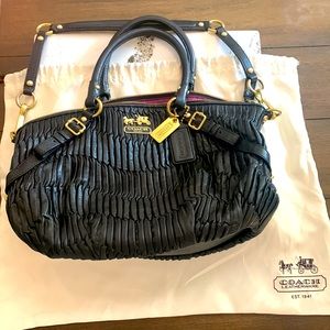 Gorgeous pinch pleated black leather Coach purse.